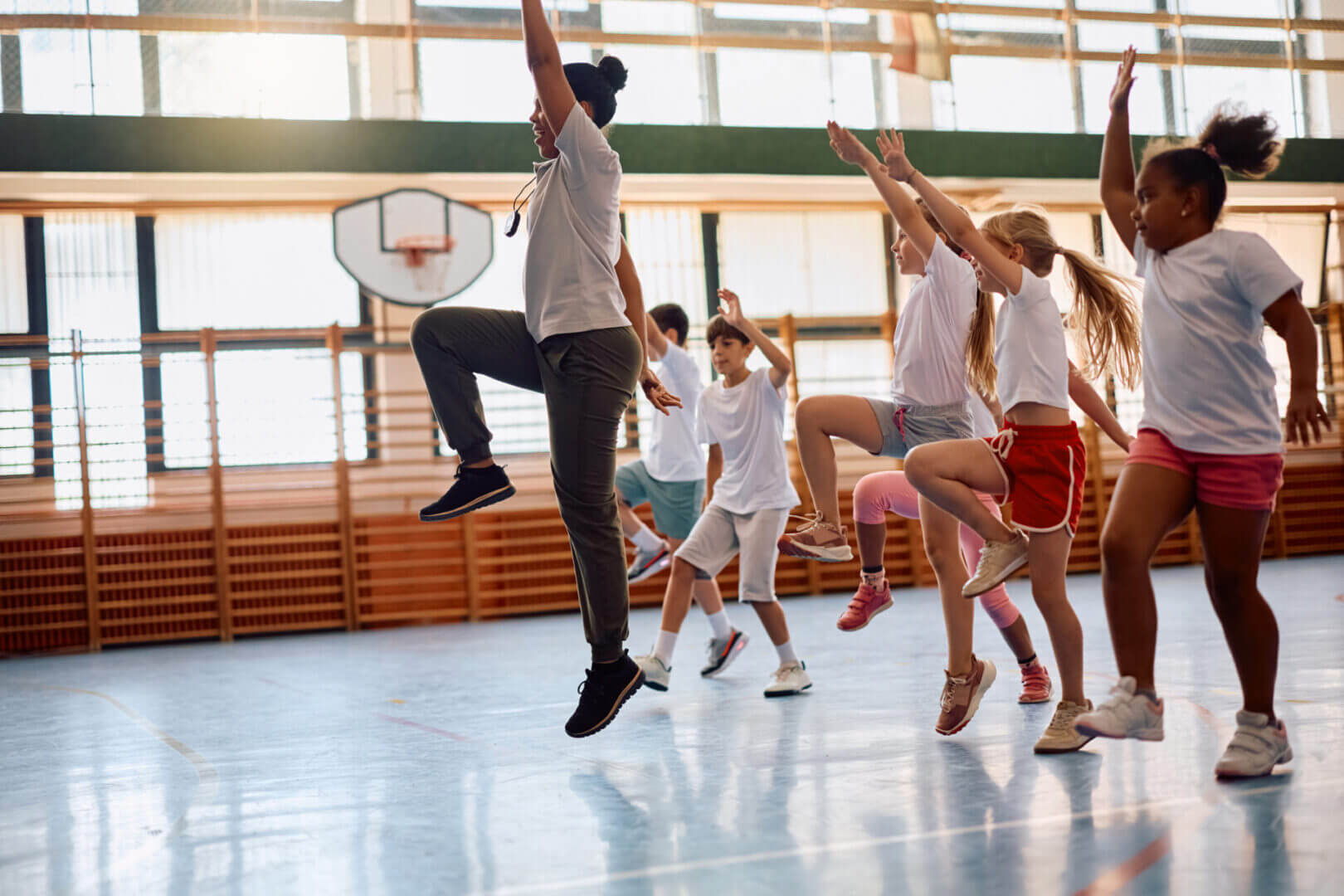 A group of people exercising together in a gym.