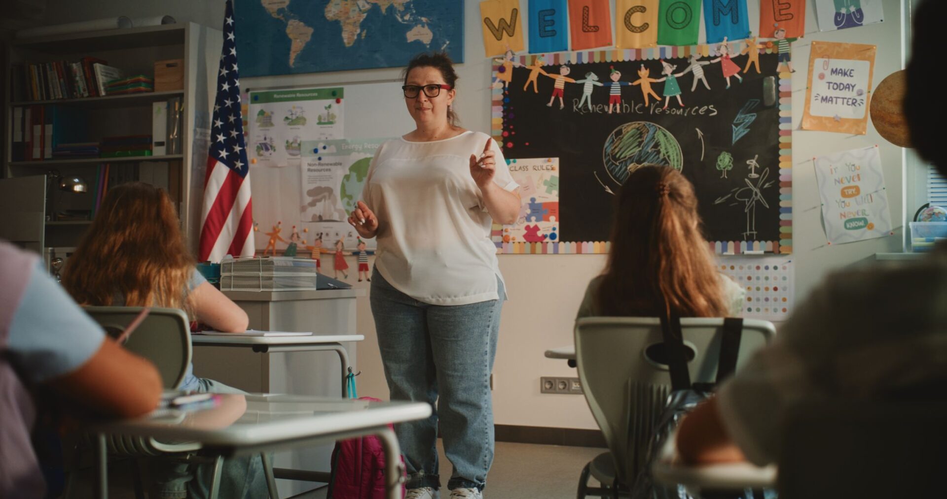 Teacher engaging students in a classroom discussion.
